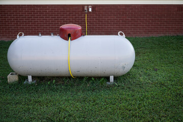 250 Gallon Propane tank with yellow copper pipe 