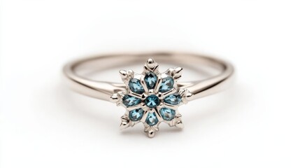 Snowflake ring with icy blue stones, embodying winter's beauty