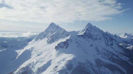 Obraz premium High-altitude shots of a snow-covered mountain range, taken during the winter season