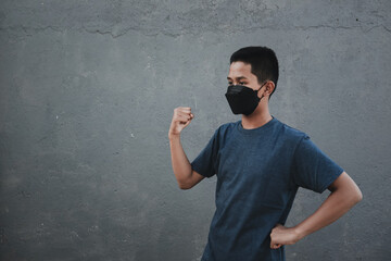 A teenager giving encouragement with their hands