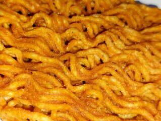 close up of spicy dry noodle snack on white background.