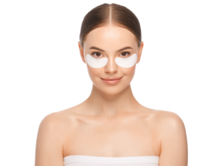 Young beautiful woman in process of morning beauty routine, applying eye patches