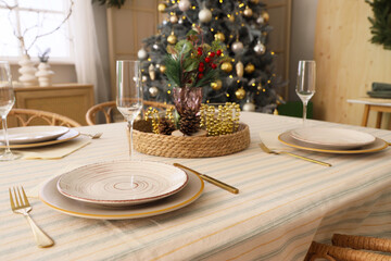 Dining table set for Christmas in room, closeup