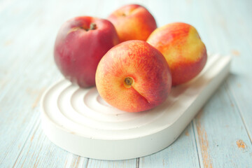 Beautiful, Fresh, and Vibrant Apples Arranged on an Elegant Decorative White Dish