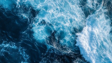 Blue waves in the ocean, captured from above,