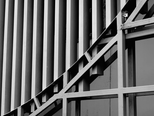 Fototapeta premium A structure featuring wooden slats on construction site contributing to its architectural style