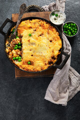 Shepherd’s Pie - ground meat with vegetables, topped with mashed potatoes, and cheese. Baked.