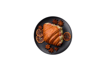 Crispy sweet red croissant with pistachio, raspberry and strawberry