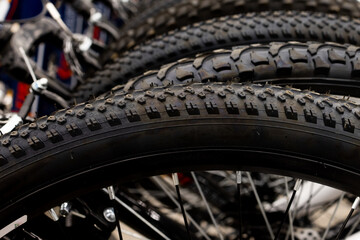  store has a new assortment of bicycle tires in storage, a stack of black tires.