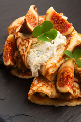 Crepes or thin pancakes with gorgonzola cheese, honey and figs fruits