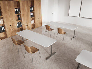 Top view of class room interior with chairs in row, door and blackboard