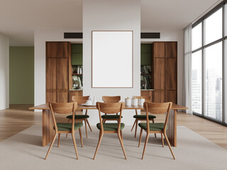 Modern dining room with wooden table and chairs, featuring a blank art poster on the wall. Large windows and wooden cabinets in the background. Interior design concept. 3D Rendering
