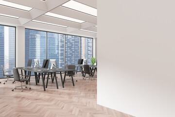 Spacious modern office interior with large windows, desks, and chairs. Blank wall on the right for mockup or template. Bright and professional environment. 3D Rendering