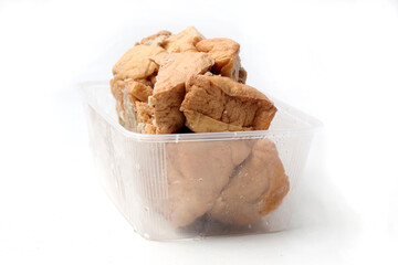 This food made from tofu which filled with meatballs, frozen, isolated on white background