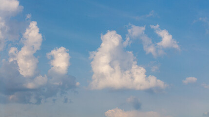 Clouds on the blue sky as a background