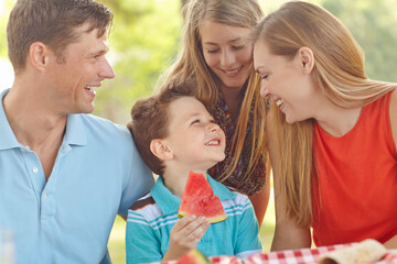 Happy family, love and excited in nature for picnic, fun activity or watermelon for refreshing...