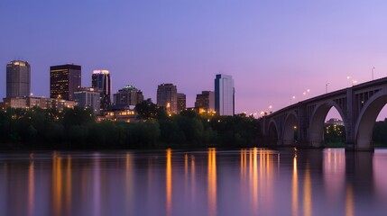 Minneapolis skyline with the Stone Arch Bridge over the Mississippi River at dusk.