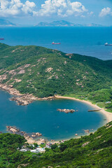 Fototapeta premium A beautiful scenery from Lamma Island hiking trails from Sok Kwu Wan and ling kok shan overlook the shoreline in the deep ocean blue