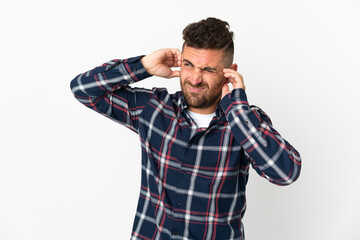 Caucasian man isolated on white background frustrated and covering ears