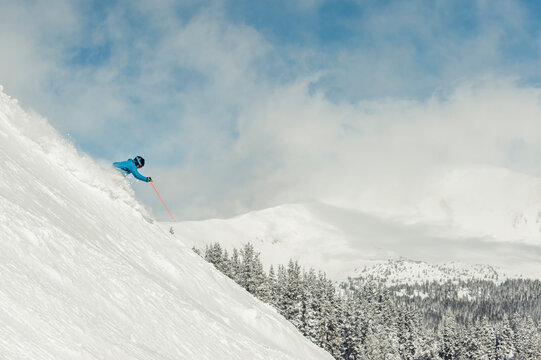 Skier at Monarch Mountain resort skiing powder