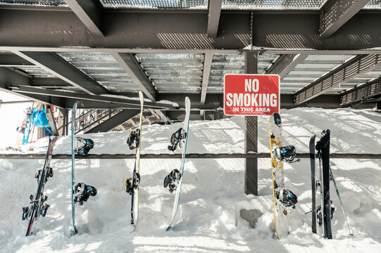 Snowboards leaned against a railing at Monarch Mountain resort