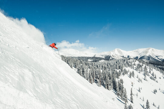 Skier at Monarch Mountain resort skiing powder