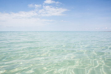Clear shallow ocean water towards horizon