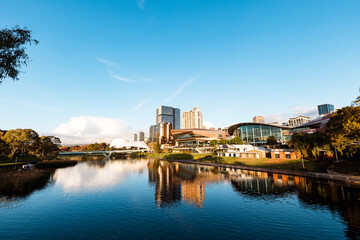 View of Adelaide city across the Torrens River with buildings reflected in water