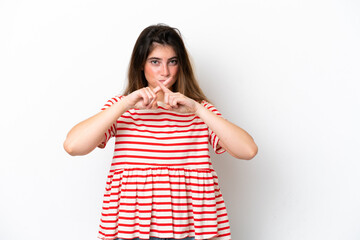 Young caucasian woman isolated on white background showing a sign of silence gesture