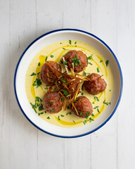 Fried meatballs with curry sauce. Top view table with  decoration.