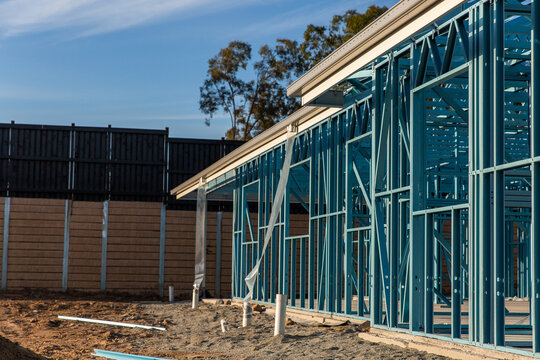 side of a house being built with a steel frame