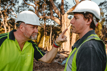Two building contractors in a heated argument at the construction site.