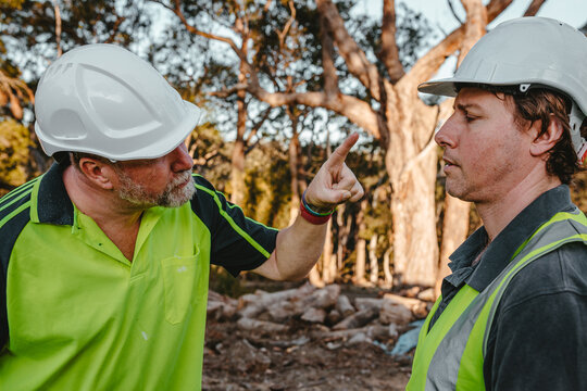 Two building contractors in a heated argument at the construction site.