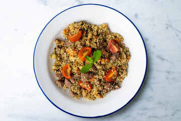 Couscous with beef and vegetables. Top view table with  decoration.