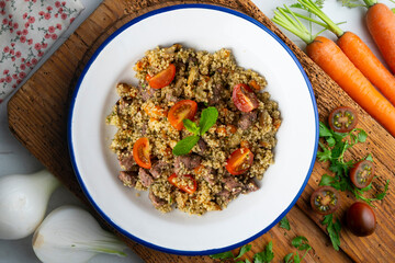 Couscous with beef and vegetables. Top view table with  decoration.