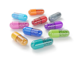 Colorful medicine pills capsules on white background
