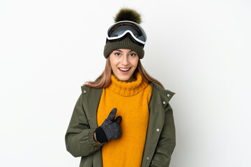 Skier caucasian woman with snowboarding glasses isolated on white background with surprise facial expression