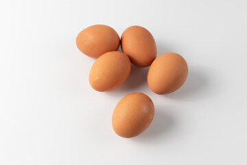 Fresh Chicken Eggs, close-up of eggs on white.