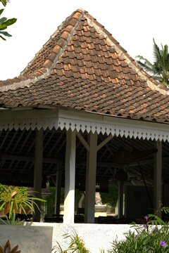 Traditional Javanese house and hall building called Joglo with clat roo tile and wooden pillar