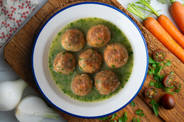 Fish meatballs with green parsley sauce. Top view table with  decoration.