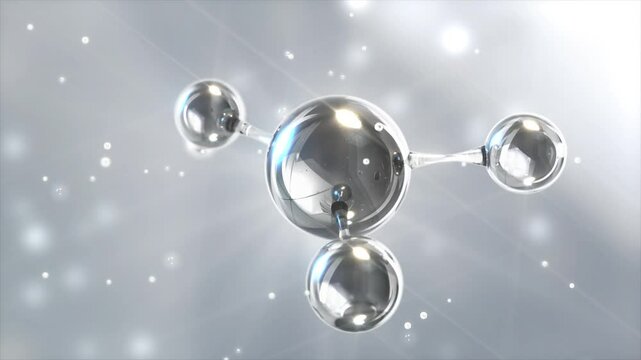 A spherical molecular structure with transparent spheres, radiating light, depicting the concept of atoms and chemical bonds.