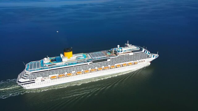 Cruise ship sailing in the sea, aerial view. Romantic holiday vacation on luxury cruise liner