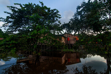 Fototapeta premium picturesque reflection of traditional stilt house. 
