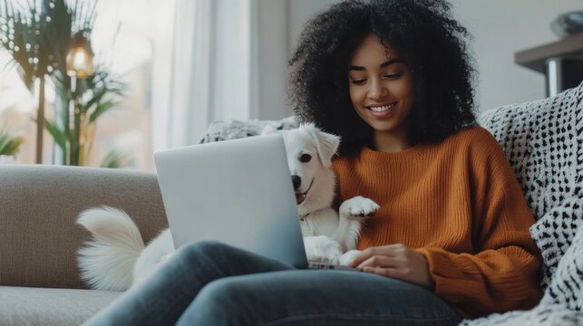 Smiling Woman with Curly Hair Enjoying Time with Her Dog at Home