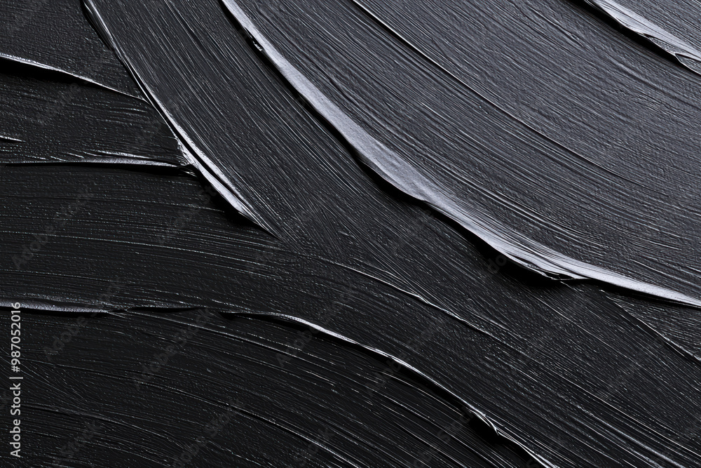 Poster a close-up of textured black paint strokes, showcasing depth and smoothness. perfect for backgrounds