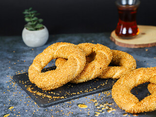 Turkish fast food bagel called Simit with tea. 