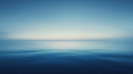 Fototapeta premium A smooth gradient background transitioning from sky blue to deep navy, creating a calming atmosphere perfect for serene designs.