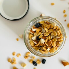 Sweet Homemade Granola in Glass Jar with Nuts
