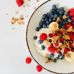 Bowl with Berry, Banana, Yogurt and Granola for Breakfast