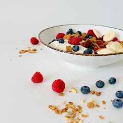 Bowl with Berry, Banana, Yogurt and Granola for Breakfast